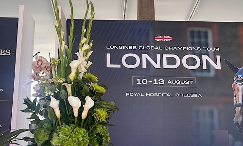 Longines Global Champions Tour large white and green reception desk floral display