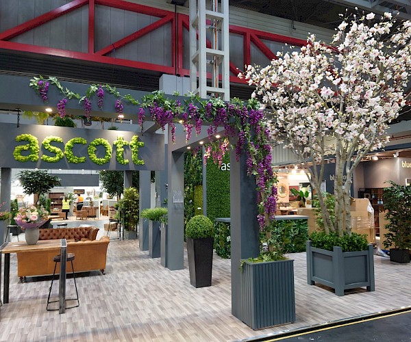 Artificial Planting on exhibition stand featuring moss blossom trees and more