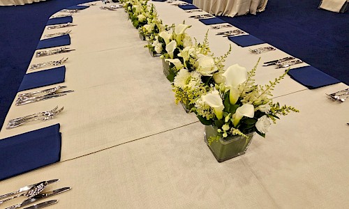 Royal International Air Tattoo long line of small white table floral displays