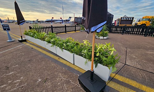 Royal International Air Tattoo troughs lining exhibition stand outdoors