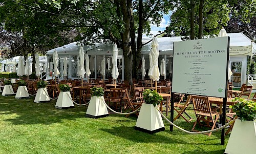 Royal Ascot planted barriers with rope and furniture wooden tables and chairs