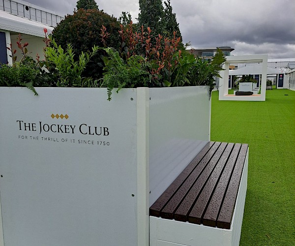 custom bench for events with planting in the middle and branded