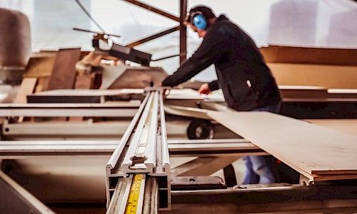 January Furniture Show carpenters building in warehouse