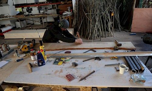 January Furniture Show carpenters building in warehouse