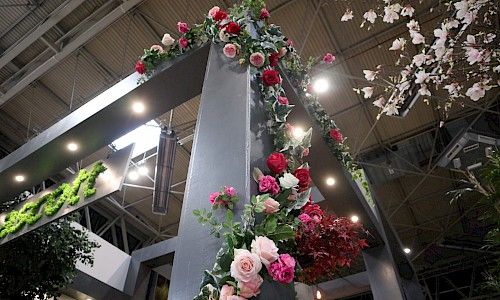January Furniture Show artificial climbing florals planting on exhibition stand